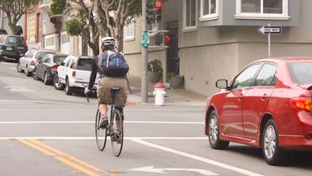 Bicyclist at Turning Lane at Red light