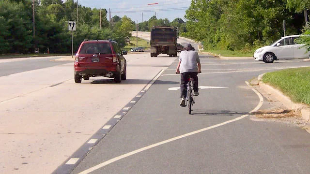 Cyclist Riding Straight in right turn lane